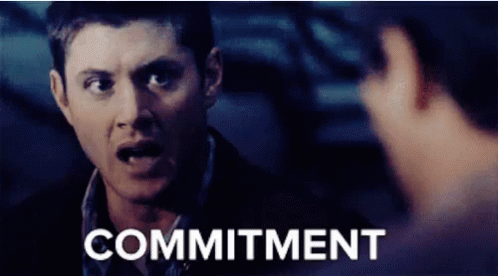 A man with a serious expression emphatically says "COMMITMENT" in bold text. His intense demeanor highlights the importance of the word, suggesting a strong focus on dedication or responsibility in the moment.